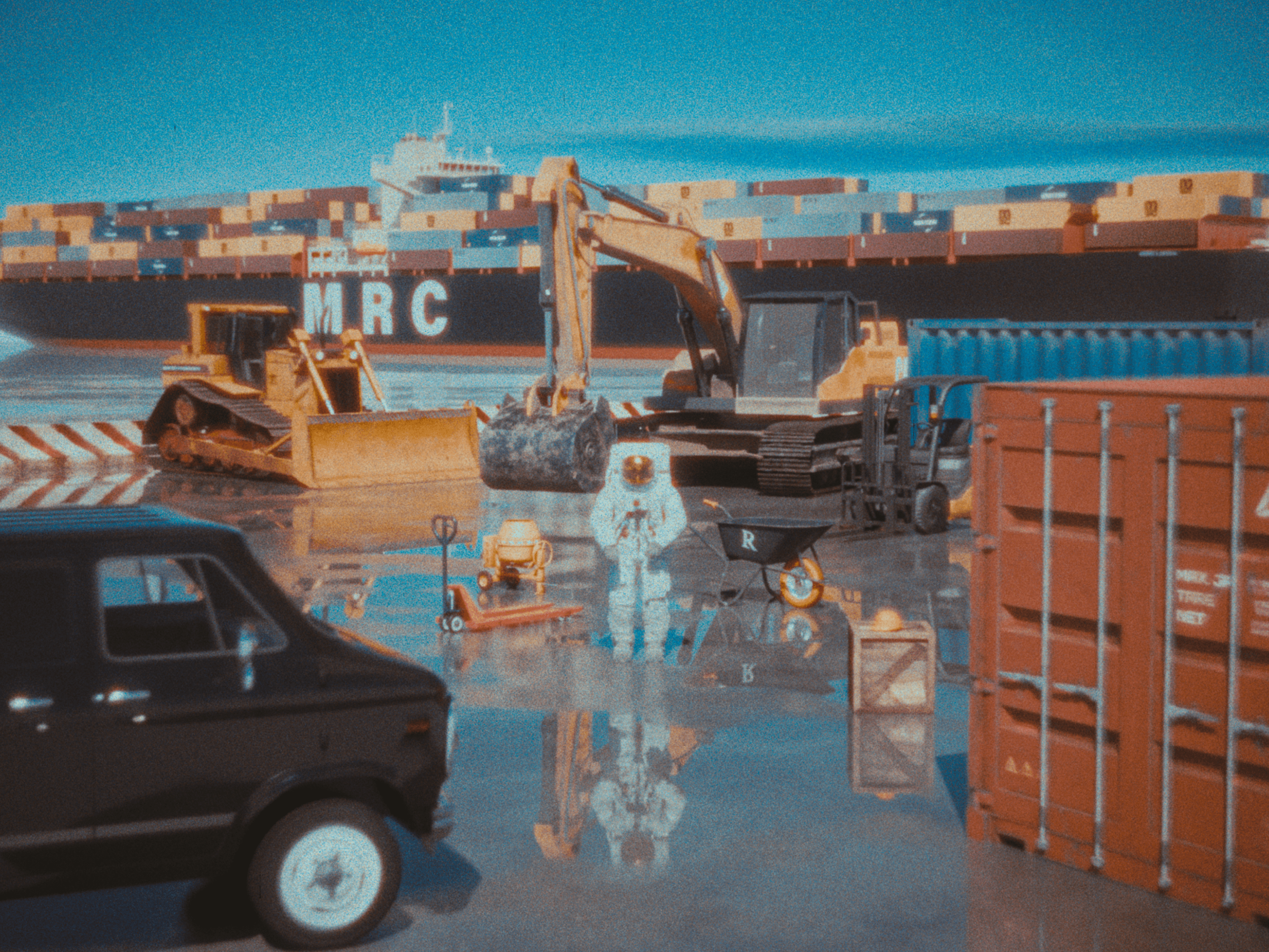Miss A7L Standing at a container terminal amongst heavy industrial equipment.